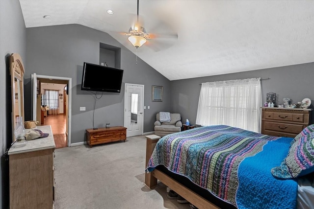 bedroom with vaulted ceiling, light carpet, and ceiling fan