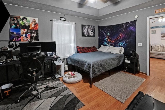 bedroom with hardwood / wood-style flooring