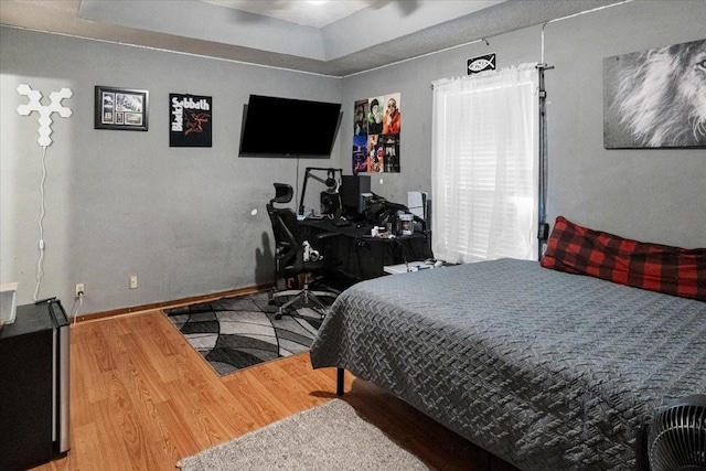 bedroom with hardwood / wood-style flooring