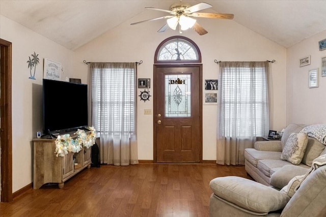 living room with lofted ceiling, wood-type flooring, and ceiling fan