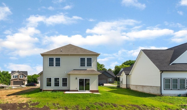 rear view of property with a patio and a yard