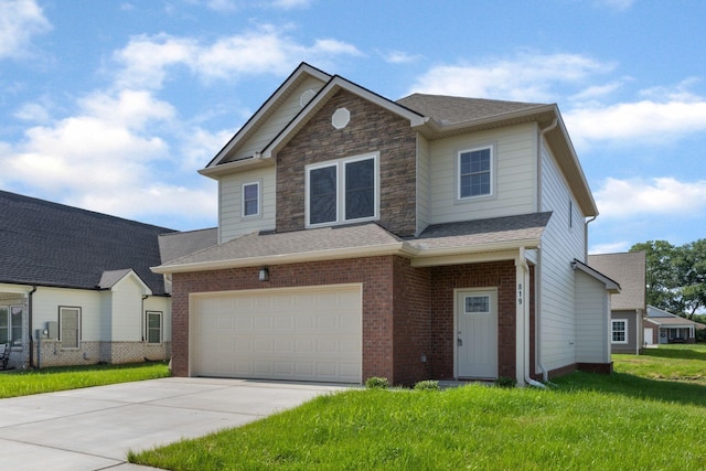 view of front of property featuring a garage and a front yard