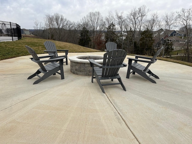 view of patio / terrace featuring an outdoor fire pit