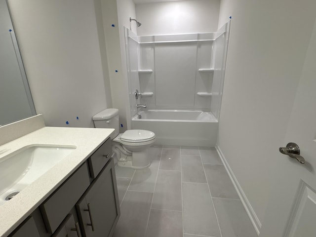 full bathroom featuring vanity, tile patterned floors, toilet, and washtub / shower combination