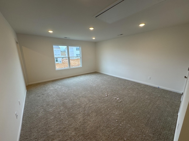 empty room with dark carpet