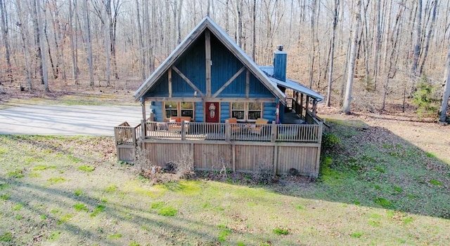 back of house with a lawn