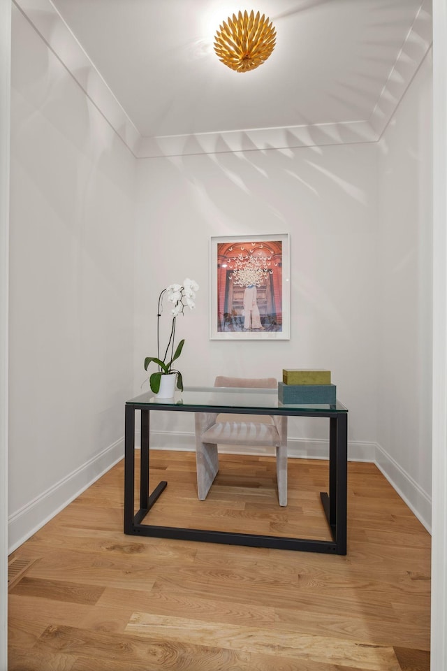 office featuring ornamental molding and wood-type flooring