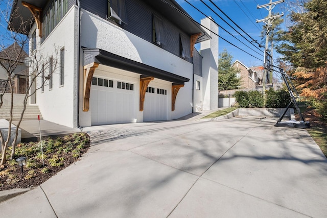 view of side of home with a garage