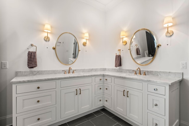 bathroom featuring tile patterned flooring and vanity