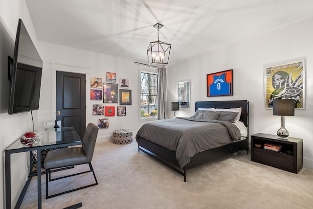 carpeted bedroom featuring an inviting chandelier