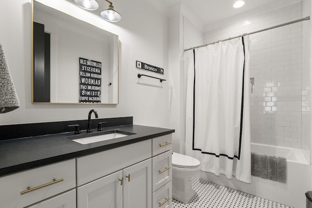 full bathroom featuring shower / tub combo with curtain, vanity, and toilet