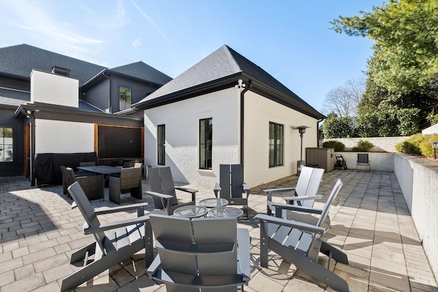 view of patio / terrace featuring an outdoor fire pit