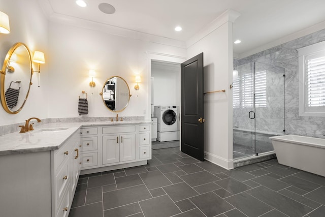 bathroom with vanity, washer / clothes dryer, crown molding, and separate shower and tub