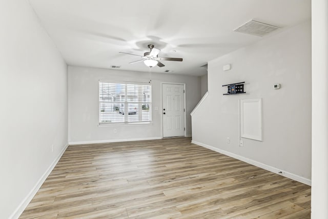 interior space with ceiling fan and light hardwood / wood-style floors