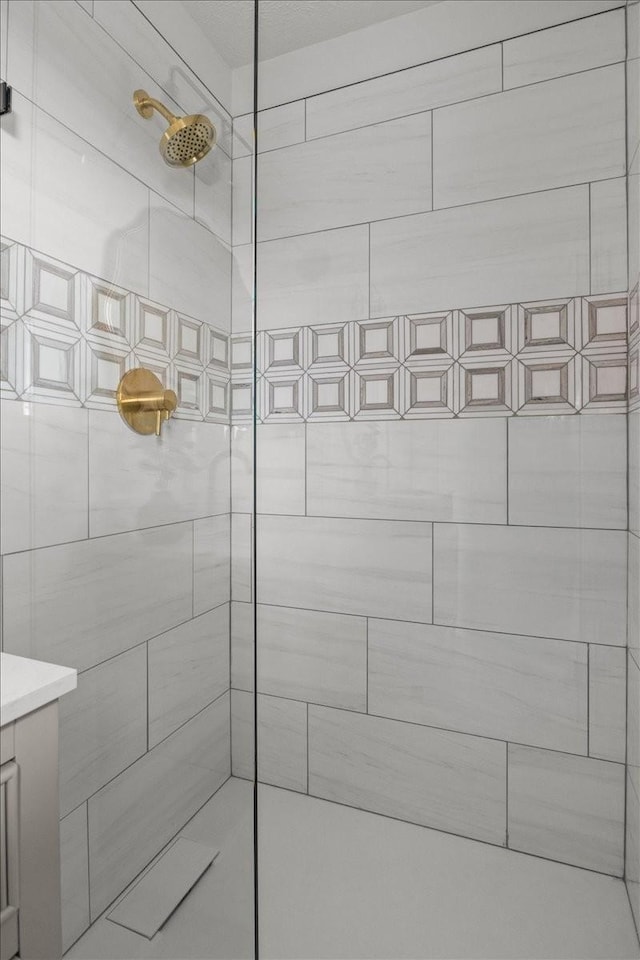 bathroom with a tile shower