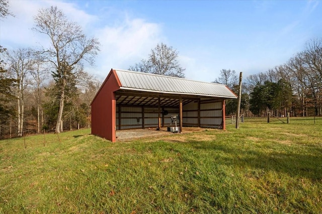 view of outbuilding featuring a yard