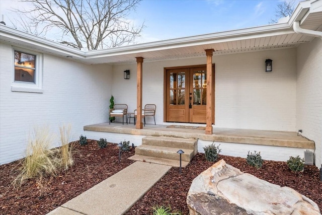 property entrance with french doors and a porch