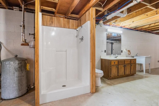 bathroom featuring toilet, vanity, concrete flooring, and walk in shower