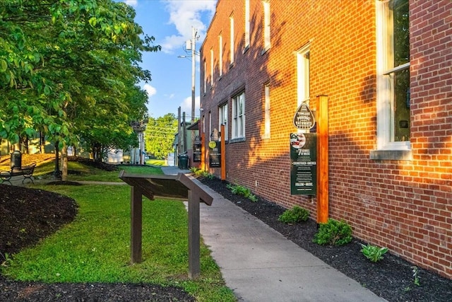 view of side of property with a yard