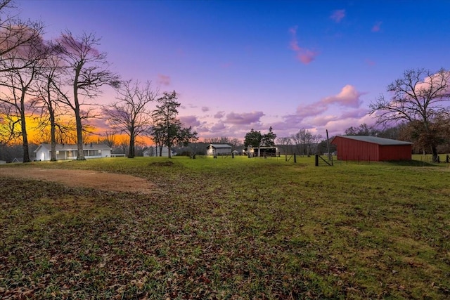 view of yard at dusk