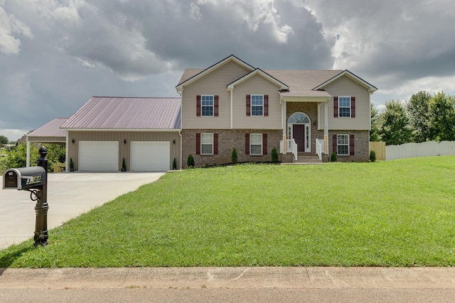 raised ranch with a garage and a front yard