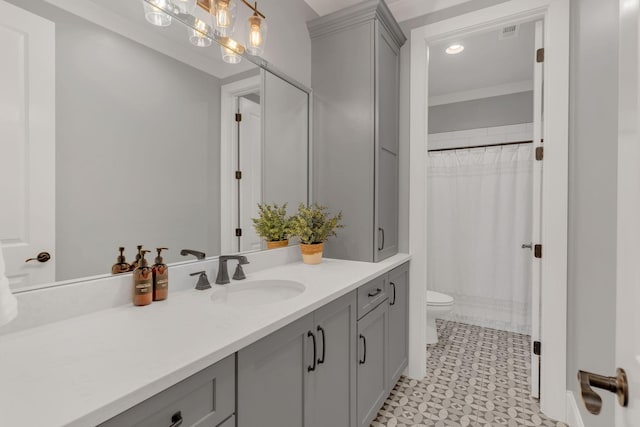 bathroom featuring a shower with curtain, vanity, crown molding, and toilet