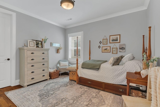 bedroom featuring crown molding and hardwood / wood-style flooring