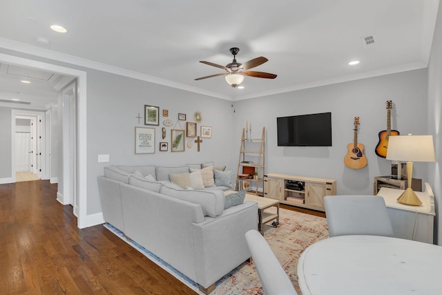 living room with ornamental molding, ceiling fan, and dark hardwood / wood-style flooring