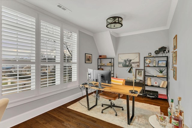 office with ornamental molding and dark hardwood / wood-style flooring