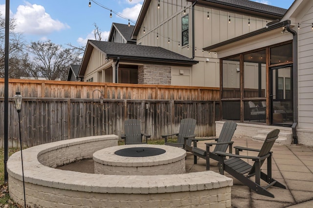 view of patio / terrace with an outdoor fire pit