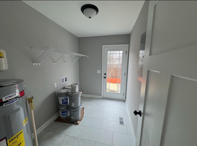 laundry area featuring water heater and washer hookup