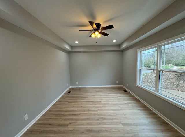 spare room with ceiling fan and light hardwood / wood-style floors