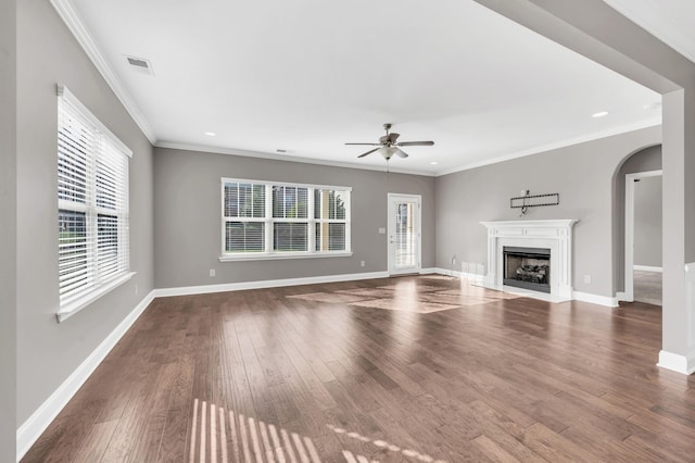 unfurnished living room featuring crown molding, ceiling fan, and hardwood / wood-style floors