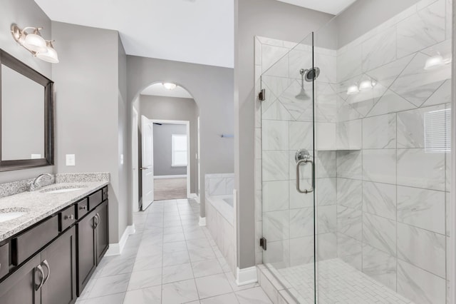 bathroom featuring vanity and separate shower and tub