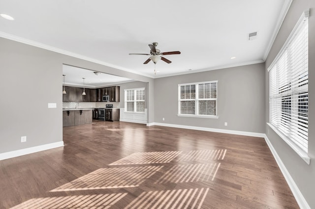 unfurnished living room featuring crown molding, ceiling fan, and dark hardwood / wood-style flooring