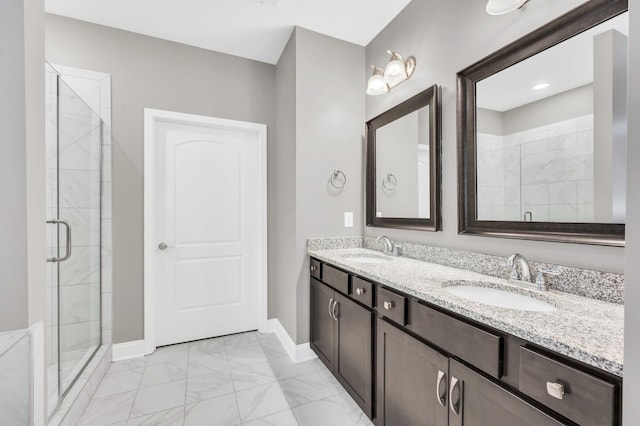 bathroom with vanity and a shower with door