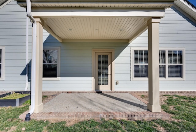 entrance to property with a patio