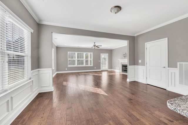 unfurnished living room featuring ornamental molding, dark hardwood / wood-style floors, and ceiling fan