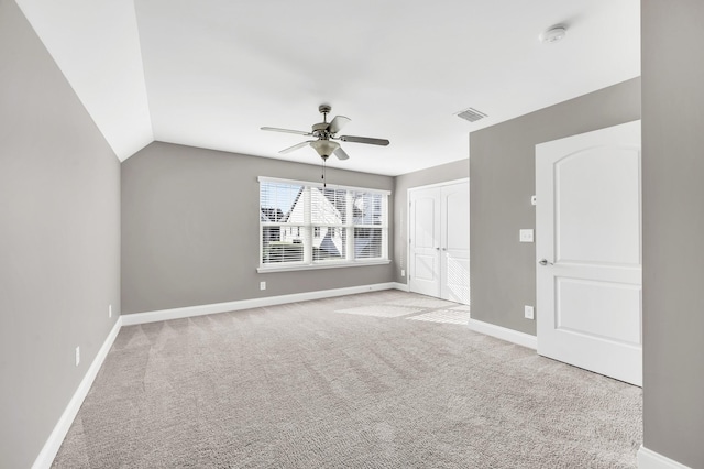 bonus room with lofted ceiling, light colored carpet, and ceiling fan