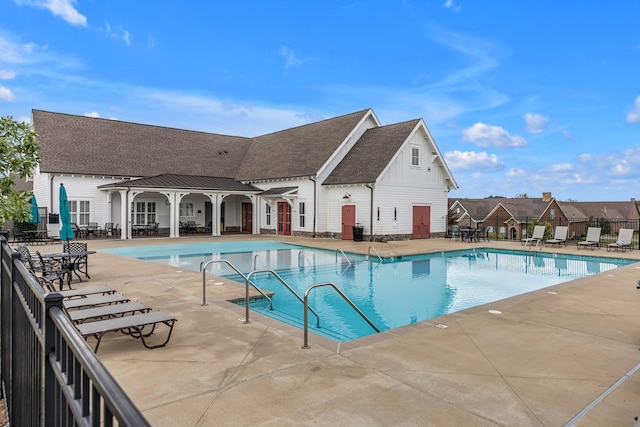 view of swimming pool with a patio area