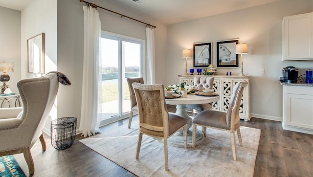 dining area featuring dark hardwood / wood-style floors