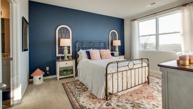 bedroom with light colored carpet