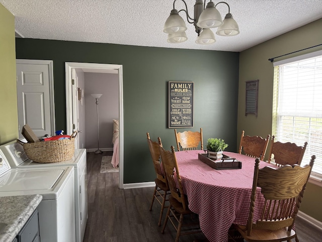 dining room featuring separate washer and dryer, plenty of natural light, dark wood-style floors, and an inviting chandelier