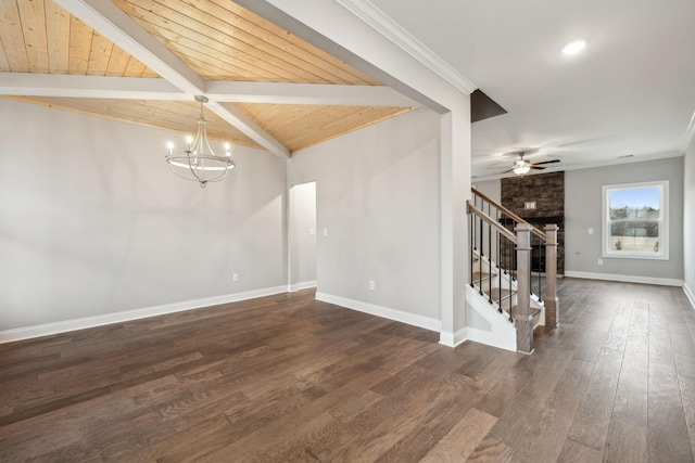 spare room with beamed ceiling, stairs, baseboards, wood ceiling, and dark wood-style flooring