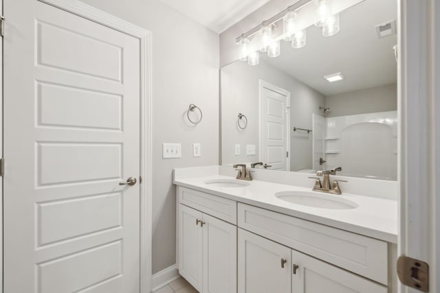 bathroom featuring vanity and shower / bath combination