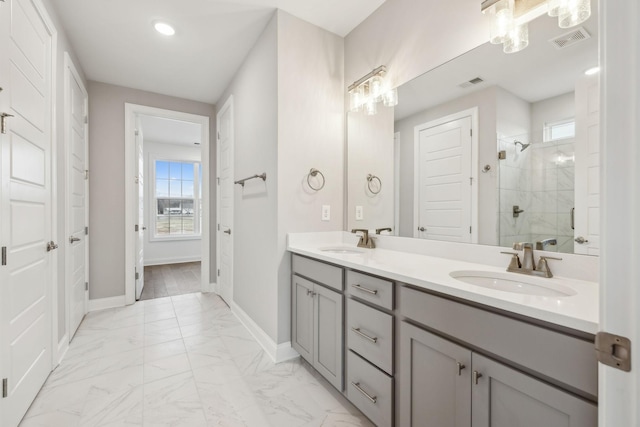 bathroom with plenty of natural light, an enclosed shower, and vanity