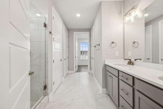 bathroom featuring vanity and a shower with shower door