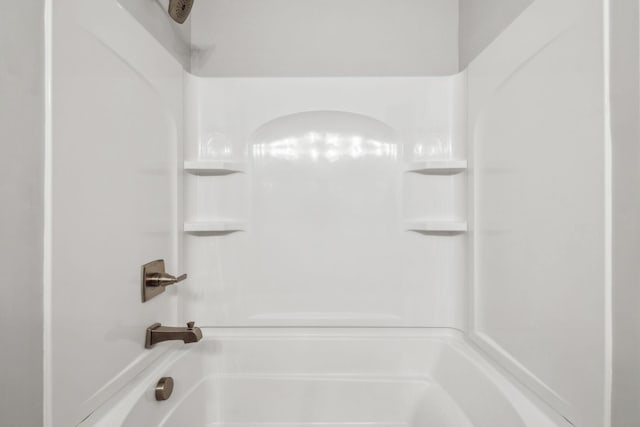 bathroom with shower / tub combination