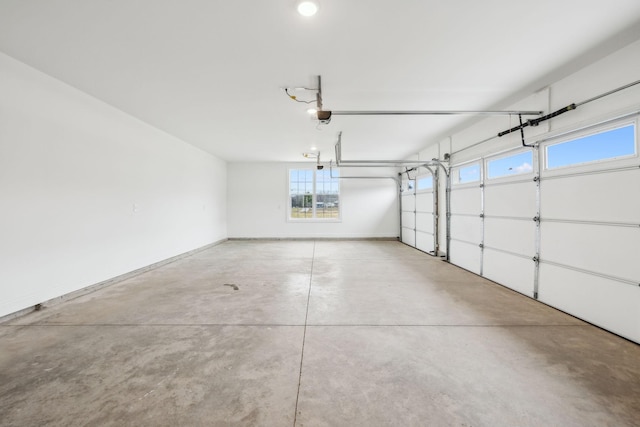 garage featuring baseboards and a garage door opener