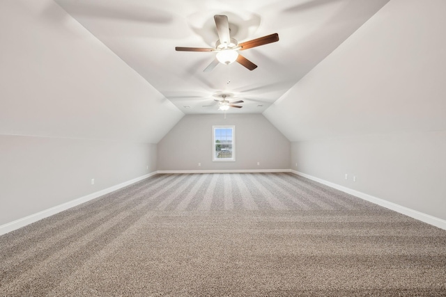 bonus room featuring lofted ceiling and carpet flooring